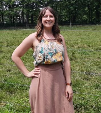 Northeast SARE Grant Administrator Kaitlyn Sirna smiling at a farm